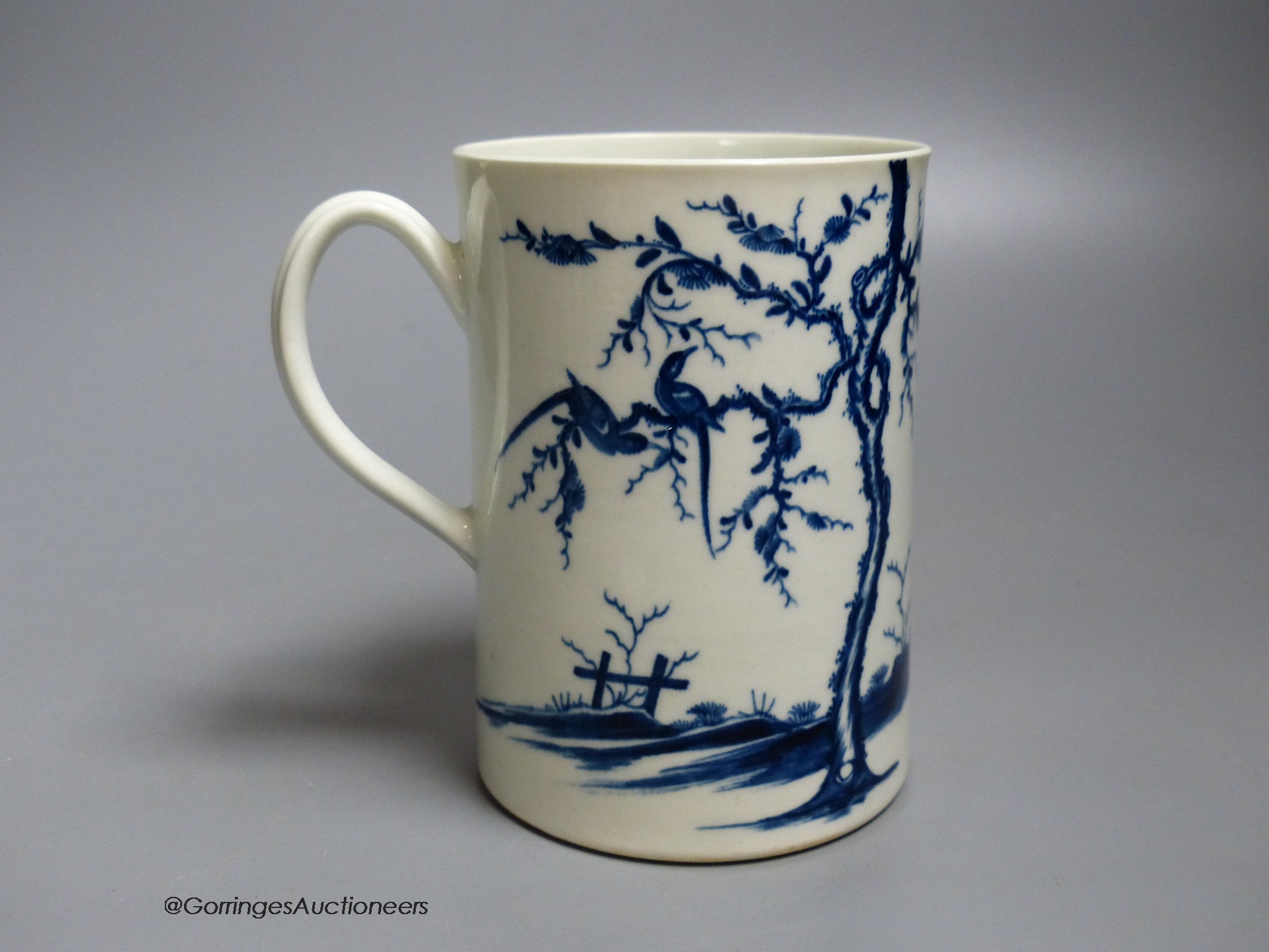 A Worcester 'Walk in the garden' pattern cylinder mug, painted in underglaze blue, open crescent mark, height 12.5cm